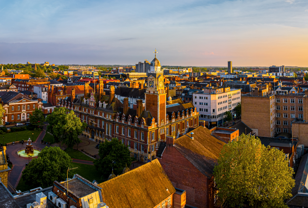 Support worker helping child to read in a residential setting